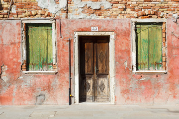 Burano, Venezia, Italy. Details of the windows and doors of the colorful houses in Burano island