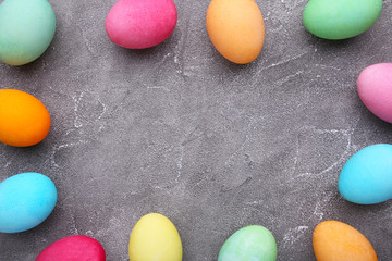 Colorful easter eggs on grey cement background