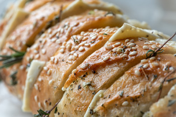 Baguette with butter, garlic and rosemary, french food.