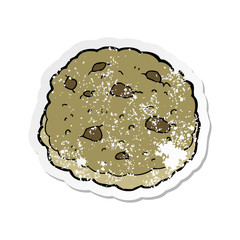 retro distressed sticker of a chocolate chip cookie cartoon