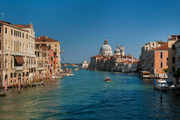 Grand Canal and Basilica Santa Maria della Salute, Venice, Italy. The Grand Canal of Venice near the Academia Bridge on a beautiful sunny summer day. 