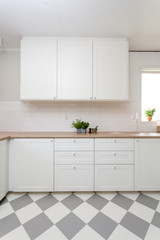 clean kitchen counter top with white cupboards