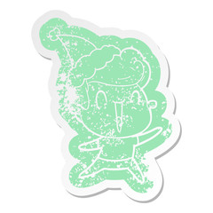 cartoon distressed sticker of a excited man wearing santa hat