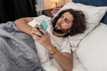 Emotional stressed man looking at the time