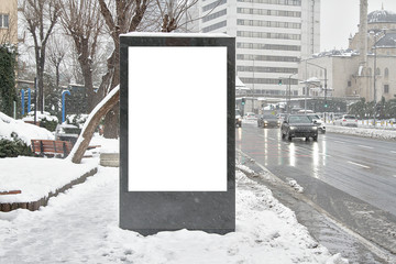 Billboard on street in winter
