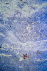 A background made of blue azurite that is heavily weathered with lots of texture.