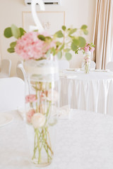 Tables set for an event party or wedding reception. luxury elegant table setting dinner in a restaurant. glasses and dishes.