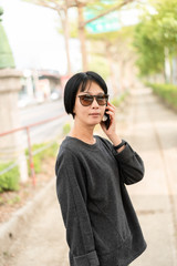 Asian woman talking on cellphone
