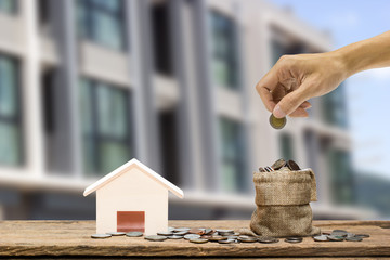 Fototapeta na wymiar Savings money to buy home. Real estate investment concept.