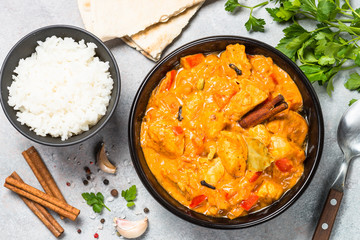 Chicken tikka masala with rice top view.