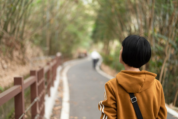 Fototapeta premium Asian woman walk on a path