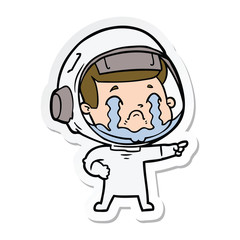 Fototapeta premium sticker of a cartoon crying astronaut