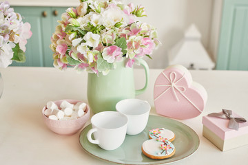 Gingerbreads for March 8 in the bright kitchen with flowers
