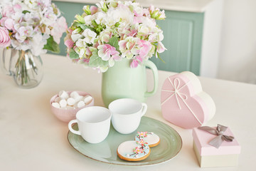 Gingerbreads for March 8 in the bright kitchen with flowers