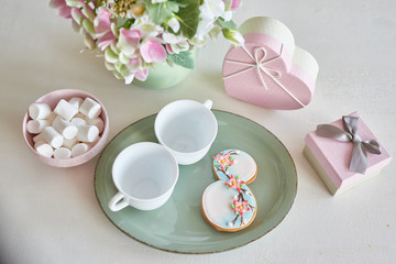 Gingerbreads for March 8 in the bright kitchen with flowers