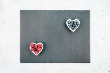 Valentine Day composition berries in heart plates