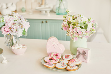 Gingerbreads for March 8 in the bright kitchen with flowers