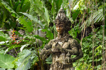 Stone statue of multiarm god in Bali.