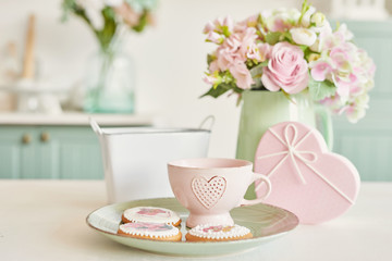 Gingerbreads for March 8 in the bright kitchen with flowers