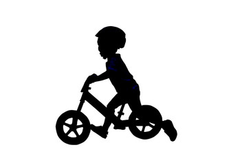Fototapeta na wymiar Silhouette Balance Bike for kids. This Boy practicing balance With a bicycle using a plowed leg is a bike without a spinning ladder.