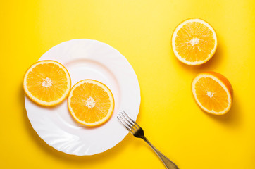 orange fruit on a yellow background