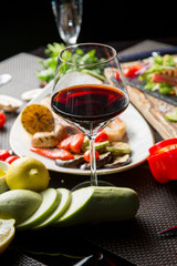 glass of dry red wine in a beautiful glass. Georgian cuisine. Georgian wine.