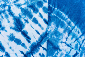 The fabric indigo tie dye as a background and texture.