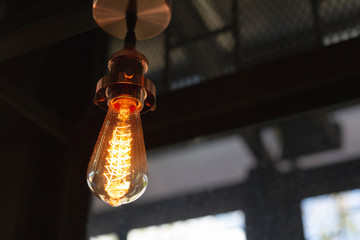 Close up of Illuminated light bulb with copy space.