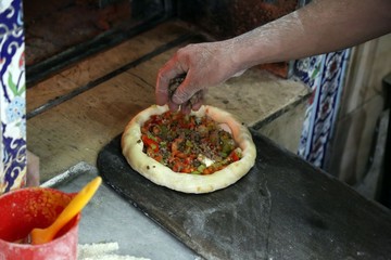 pide master makes pide with meat and vegetables .artvin/turkey