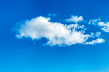 Bright blue sky with big cloud, background