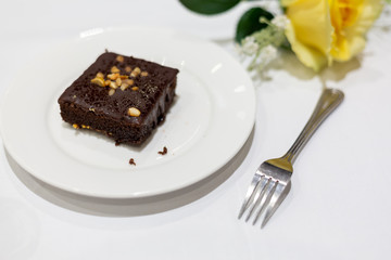 Brownies  on a white plate.