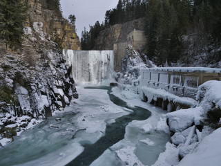 old hydro dam in the winter with waterfalls