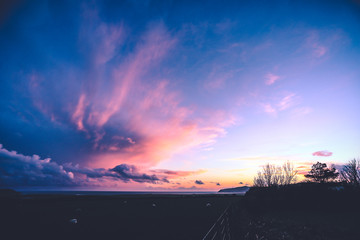 Abersoch, Wales, UK. 4, March, 2019. Dramatic sunset over Hell's Mouth beach, after storm Freya hit the UK. © Dafydd Owen/Alamy Live News