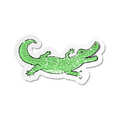 retro distressed sticker of a cartoon crocodile