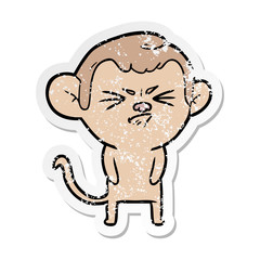 distressed sticker of a cartoon annoyed monkey