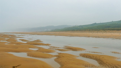 5970_The_wide_shore_of_the_low_tide_in_Omaha_Beach.jpg