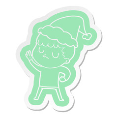 cartoon  sticker of a grumpy boy wearing santa hat