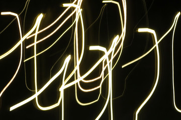 an abstract photo of light lines on dark background