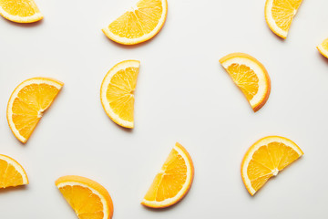 Top view of juicy orange slices on white background