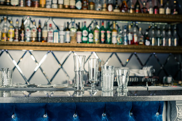 empty cocktail glasses at the bar