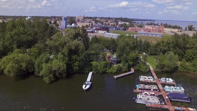 Rising aerial drone shot of downtown Bemidji, Minnesota, from Lake Irving.