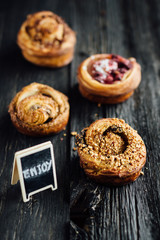Traditional french viennoiseries with message "enjoy"