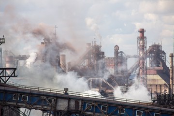 landscape, panorama, view of factory slums with metal hulls and machines for the production of the coking industry, smoking pipes and reconstruction of a plant in Ukraine