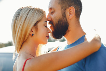 Fototapeta premium Beautiful couple spend time in a summer park