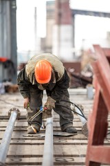 factory workers at Koksokhim, welders are engaged in the construction and installation of metal structures on high ground and in special working conditions