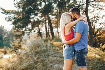 Fototapeta premium Beautiful couple spend time in a summer park