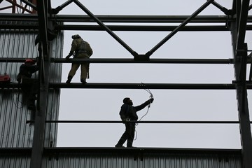 factory workers at Koksokhim, welders are engaged in the construction and installation of metal structures on high ground and in special working conditions