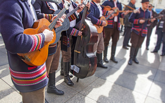 Fototapeta Traditional Croatian musicians in Slavonian costumes play in the city square