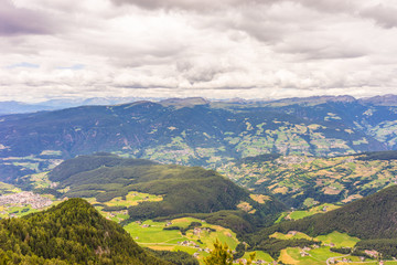 Obraz premium Alpe di Siusi, Seiser Alm with Sassolungo Langkofel Dolomite, a view of a large mountain in the background