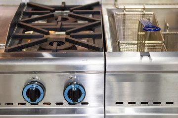 modern gas stove made from steel or cast iron or copper with deep fryer pot with stainless basket